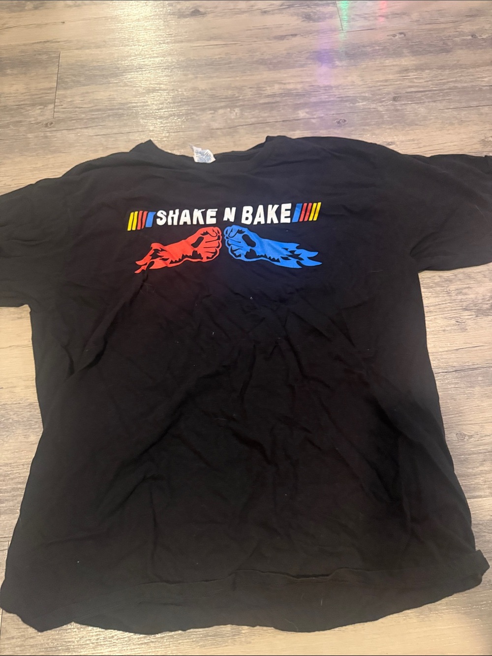 Black Graphic Tee with Red & Blue Fist Design